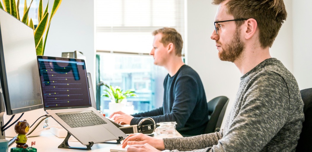 SAP Commerce specialists collaborating in an office